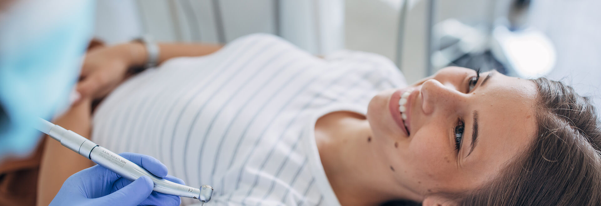 woman smiling at the dentist