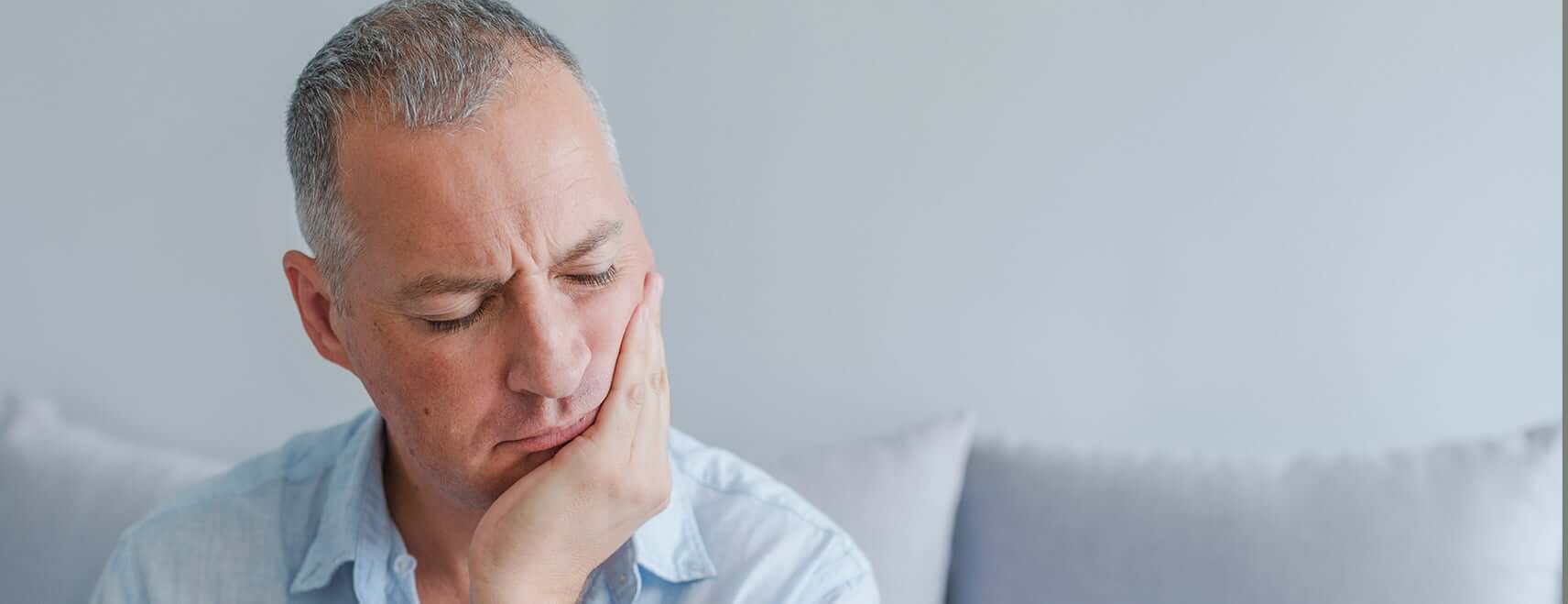 man with mouth pain