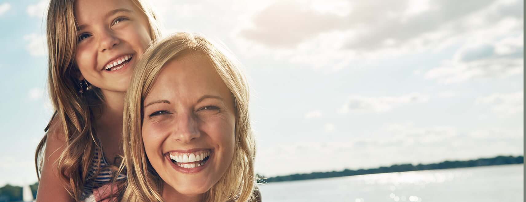 smiling woman with daughter